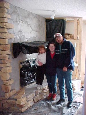 Building a fireplace using limestone from our ranch.